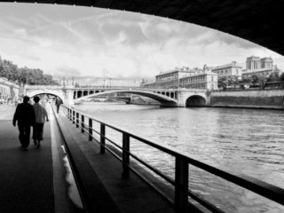 Couple walking near Notre-Dame in Paris