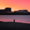 Photographer at Mers-les-Bains beach at sunset