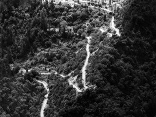 Bended road towards the village