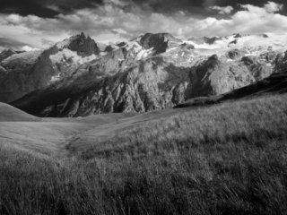 Fields and mountains in La Grave, alps