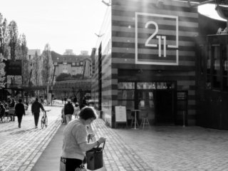 Woman looking for the keys near La Villette, Paris