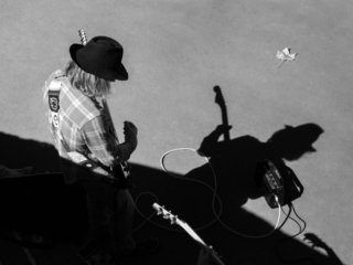 Guitar player near the Seine river in Paris, France