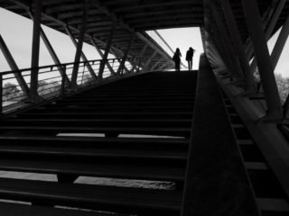 Girls crossing the Leopold Sedar Senghor bridge in Paris