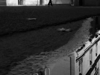 Man crossing the stree near Orsay Museum, Paris