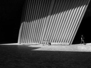 Man going in the dark at Philarmonie of Paris