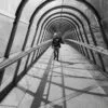 Man with a hat at the Japan bridge in La Defense